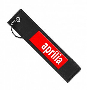 Μπρελόκ υφασμάτινο κόκκινο με κέντημα το λογότυπο APRILIA